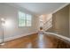 Bright living room with staircase and large window, offering plenty of natural light at 7415 Northampton Ct, Cumming, GA 30040
