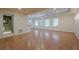 Spacious living area with wood floors, natural light, and access to an ensuite bathroom at 7415 Northampton Ct, Cumming, GA 30040