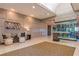 Elegant lobby area with a seating area, decorative wall paneling, and a wine display at 7415 Northampton Ct, Cumming, GA 30040