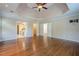 Spacious main bedroom with hardwood floors and access to the ensuite bath and a hallway at 7415 Northampton Ct, Cumming, GA 30040