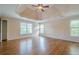 Spacious main bedroom featuring hardwood floors, tray ceilings, and plenty of natural light at 7415 Northampton Ct, Cumming, GA 30040