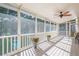 Relaxing screened porch with plenty of sunlight and views of the backyard and pool at 7415 Northampton Ct, Cumming, GA 30040