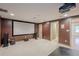 Movie room featuring a large screen, projector, carpet flooring and neutral paint at 7415 Northampton Ct, Cumming, GA 30040