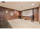 Home theater room with recessed lighting, projector screen, surround sound system, and plush carpeting at 7415 Northampton Ct, Cumming, GA 30040