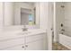 Bathroom boasts a sleek vanity, ample counter space, a shower, and a toilet at 13244 Tolstoy, Covington, GA 30014