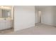 Bright bathroom featuring a modern vanity, stylish mirror, and neutral wall color at 13244 Tolstoy, Covington, GA 30014