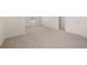 Open bonus room with carpet, natural light, with adjacent rooms and doorways at 13244 Tolstoy, Covington, GA 30014
