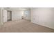 Spacious and bright bonus room featuring a window and doors to bathroom and hallway at 13244 Tolstoy, Covington, GA 30014
