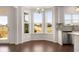 Bright breakfast nook with hardwood floors, and large bay windows offering views of the outdoors at 13244 Tolstoy, Covington, GA 30014