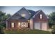 Beautiful brick home featuring a two-car garage, manicured lawn, and classic architectural details at 13244 Tolstoy, Covington, GA 30014