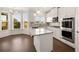 Bright kitchen with stainless steel appliances, granite counters, eat-in area and island at 13244 Tolstoy, Covington, GA 30014