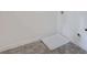 Tile floor in a laundry room corner with hookups and a white utility box at 13244 Tolstoy, Covington, GA 30014