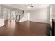 Open concept living room featuring hardwood floors and staircase at 13244 Tolstoy, Covington, GA 30014