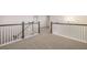 Upstairs loft area featuring carpet flooring and railing at 13244 Tolstoy, Covington, GA 30014