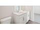 Bathroom with double sink vanity, white quartz countertop and modern fixtures at 3953 Brushy St, Powder Springs, GA 30127