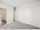 Bedroom with plush carpet, neutral paint, and access to an ensuite bathroom at 3953 Brushy St, Powder Springs, GA 30127