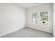 Cozy bedroom with plush carpet, neutral paint and double windows to let in light at 3953 Brushy St, Powder Springs, GA 30127