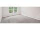 Well-lit bedroom featuring neutral carpet at 3953 Brushy St, Powder Springs, GA 30127