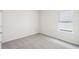 Small bedroom with plush carpet, neutral paint and bright window at 3953 Brushy St, Powder Springs, GA 30127