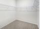 Walk-in closet with carpet flooring and wire shelving at 3953 Brushy St, Powder Springs, GA 30127