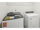 Modern laundry room with front load washer and dryer at 3953 Brushy St, Powder Springs, GA 30127