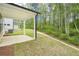 A covered patio and grassy backyard provide an ideal outdoor living space at 3961 Brushy St, Powder Springs, GA 30127