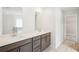 The image features a stylish bathroom with double vanity and modern fixtures at 3961 Brushy St, Powder Springs, GA 30127