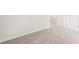 Neutral bedroom with plush carpet and a view to an open doorway at 3961 Brushy St, Powder Springs, GA 30127
