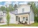 Beautiful two-story home with a covered porch and gray and white color scheme at 3961 Brushy St, Powder Springs, GA 30127