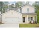 Charming two-story home with a covered front porch and attached two-car garage at 3961 Brushy St, Powder Springs, GA 30127