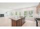 Modern kitchen with stainless steel appliances, an island, and an open floor plan at 3961 Brushy St, Powder Springs, GA 30127
