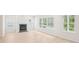 Spacious living room with a fireplace and large windows offering plenty of natural light at 3961 Brushy St, Powder Springs, GA 30127