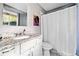Bathroom with granite countertop vanity and a shower with stylish shower curtain at 4595 Fradon Ct, Atlanta, GA 30349