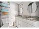 Bathroom featuring double sinks, granite countertops, and stylish decor at 4595 Fradon Ct, Atlanta, GA 30349