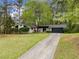 Well-maintained single-story home with lush front lawn and mature trees, offering curb appeal and a welcoming ambiance at 4595 Fradon Ct, Atlanta, GA 30349