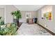 Home office featuring hardwood floors, large windows providing ample light, with space for plants and decor at 4595 Fradon Ct, Atlanta, GA 30349