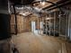 Unfinished basement with exposed utilities, wood framing, and a treadmill at 5458 Summer Pine Pl, Buford, GA 30518
