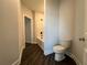 Bathroom view showcasing the toilet and bathtub with shower at 5458 Summer Pine Pl, Buford, GA 30518