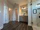 Bathroom with dual sinks and tiled shower with glass door at 5458 Summer Pine Pl, Buford, GA 30518