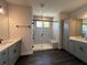 Beautiful bathroom features double vanities and tiled shower with bench at 5458 Summer Pine Pl, Buford, GA 30518