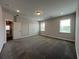 Bedroom featuring carpet, neutral walls, and two windows for natural light at 5458 Summer Pine Pl, Buford, GA 30518