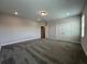 Neutral bedroom with carpet, two windows, and a closet at 5458 Summer Pine Pl, Buford, GA 30518
