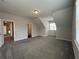 Large bedroom with carpet, natural light, and neutral walls at 5458 Summer Pine Pl, Buford, GA 30518