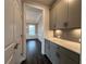 Butler's pantry with modern cabinetry, countertops, and storage at 5458 Summer Pine Pl, Buford, GA 30518