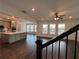 Modern kitchen with a large island, stainless steel appliances, and hardwood floors at 5458 Summer Pine Pl, Buford, GA 30518