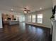 Bright living room featuring recessed lighting, hardwood floors, fireplace, and views into kitchen at 5458 Summer Pine Pl, Buford, GA 30518