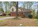 Charming brick and siding home with mature trees, two-car garage and manicured landscaping in a suburban setting at , Stone Mountain, GA 30088