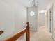 Upstairs hallway featuring carpet, a window, and several doors at , Stone Mountain, GA 30088