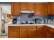 Kitchen with wood cabinets, white countertops and modern appliances at , Stone Mountain, GA 30088