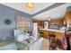 Bright and airy kitchen with a breakfast bar, table seating, wood cabinets, and adjacent dining area at , Stone Mountain, GA 30088